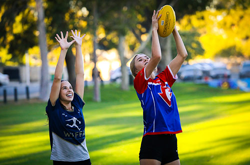 Two women playing football