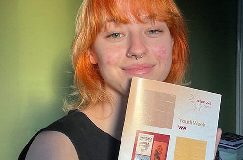 Woman holding the publication Catalyst