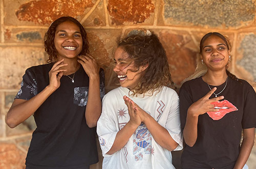Three girls smiling and laughing